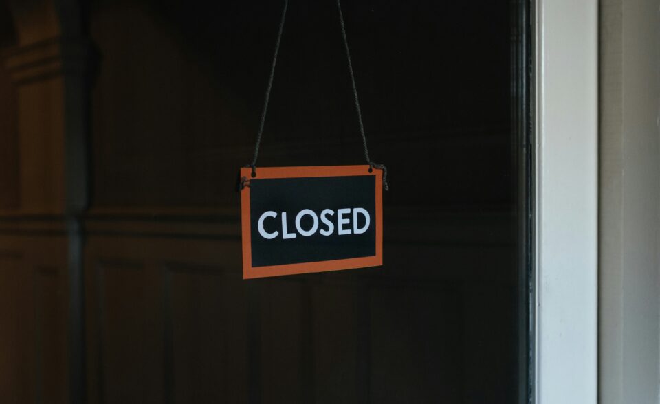 Closed sign on a door.