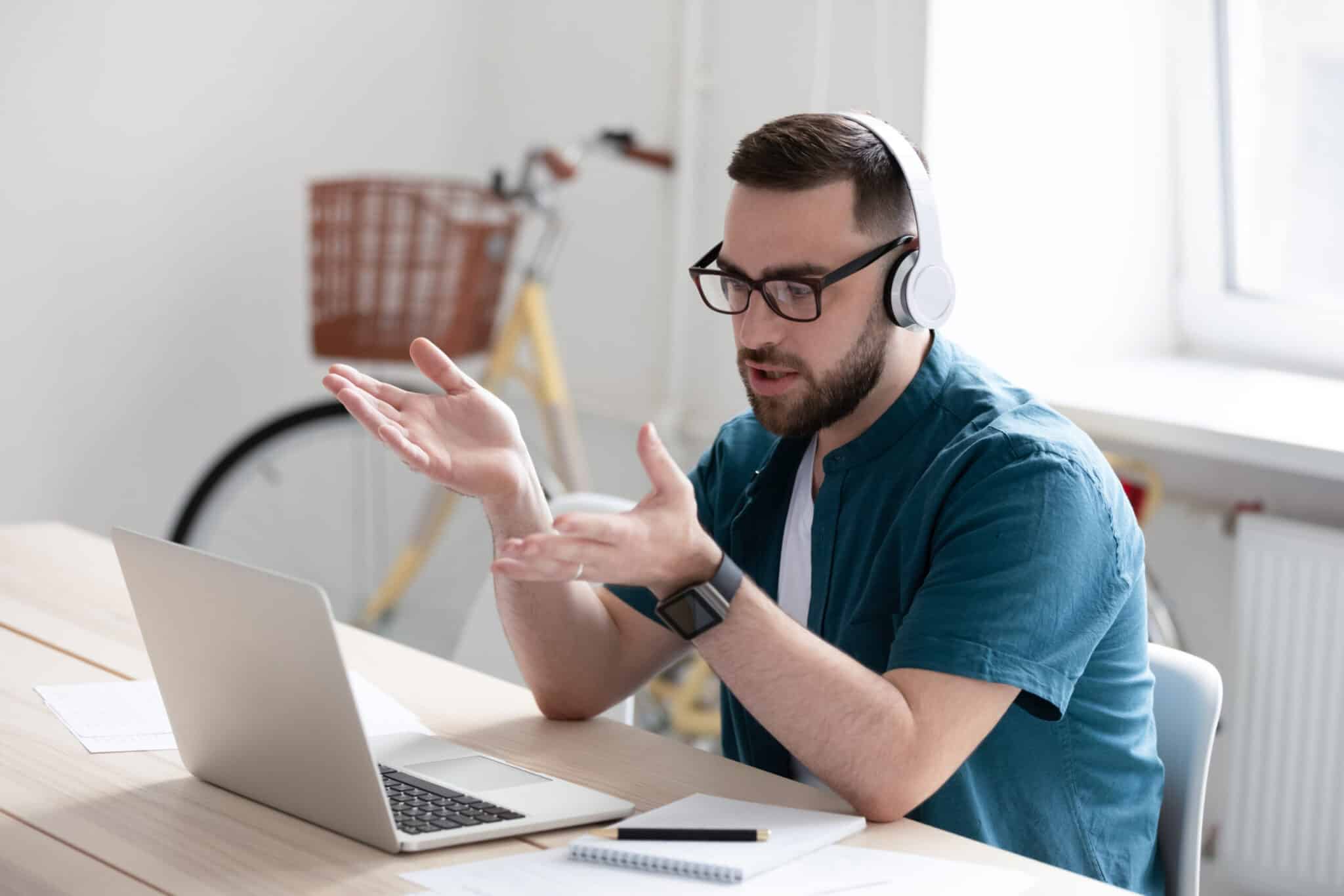 Person working from home talking on a laptop