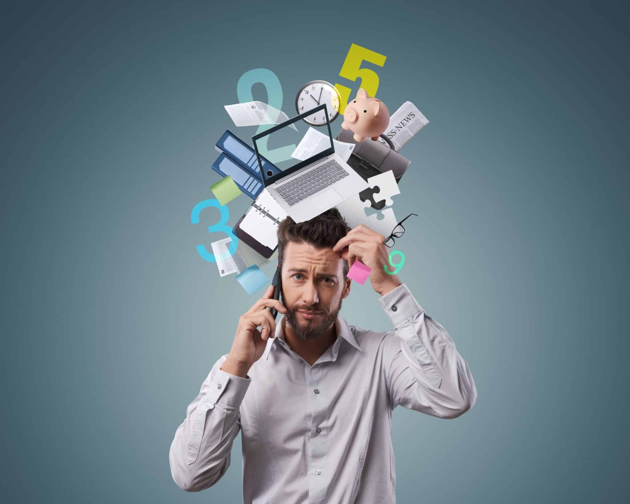 Busy man on the phone surrounded by floating tech-items like laptop, clock, documents and icons, representing information overload.