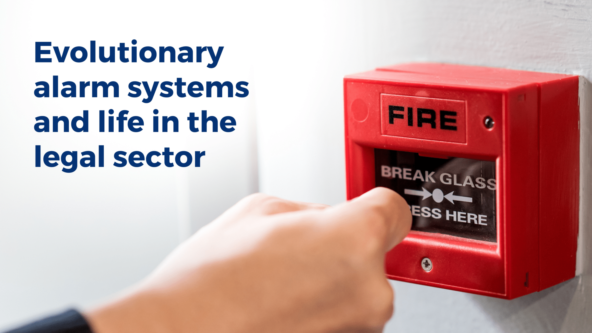 A hand presses a red fire alarm call point mounted on a wall. Large blue text alongside reads: "Evolutionary alarm systems and life in the legal sector." The image illustrates how our brains can sometimes trigger an alarm response even when there is no real danger.
